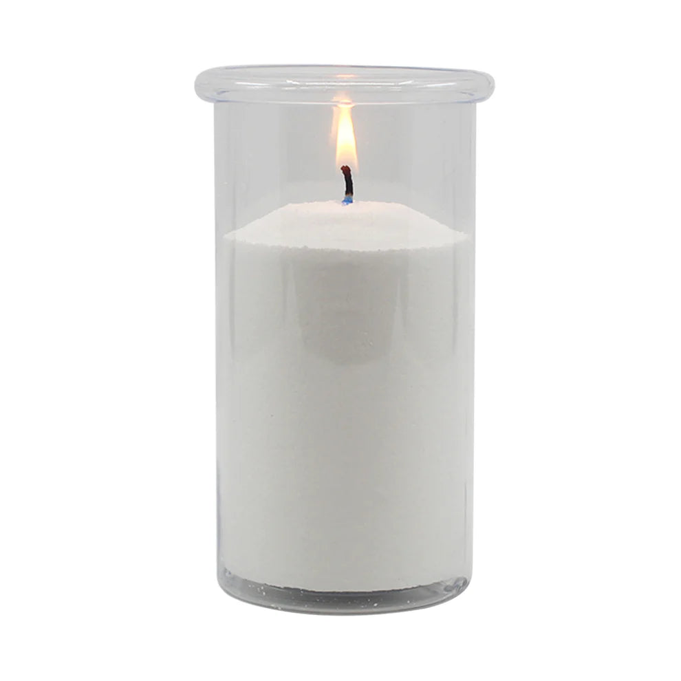 White candle in a clear glass container on a white background