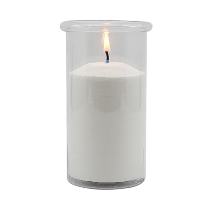 White candle in a clear glass container on a white background