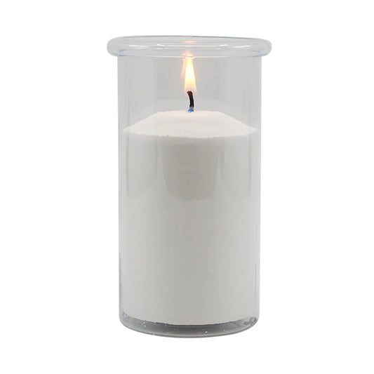 White candle in a clear glass container on a white background