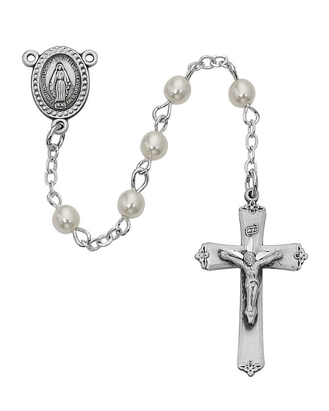 Silver rosary with pearl beads on a white background