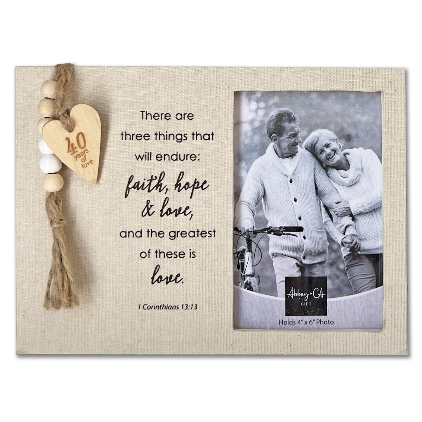 Decorative photo frame with a couple's photo and inspirational quote on a white background