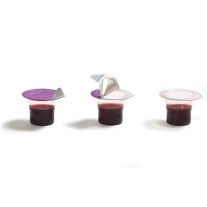 Three small transparent cups with purple lids containing a red liquid on a white background