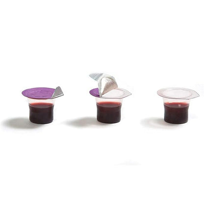 Three small transparent cups with purple lids containing a red liquid on a white background