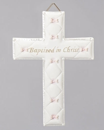 Decorative cross with 'Baptized in Christ' text and pink ribbons on a gray background