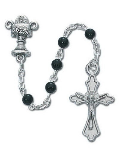 Silver rosary with black beads on a white background