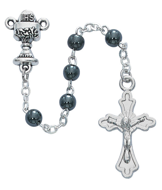 A Hematite Communion Rosary with silver oxide crucifix and communion themed center, featuring black beads and silver metallic components.