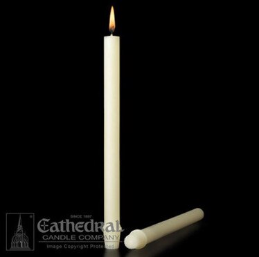White candle with a lit wick on a black background, featuring the Cathedral Candle Company logo.