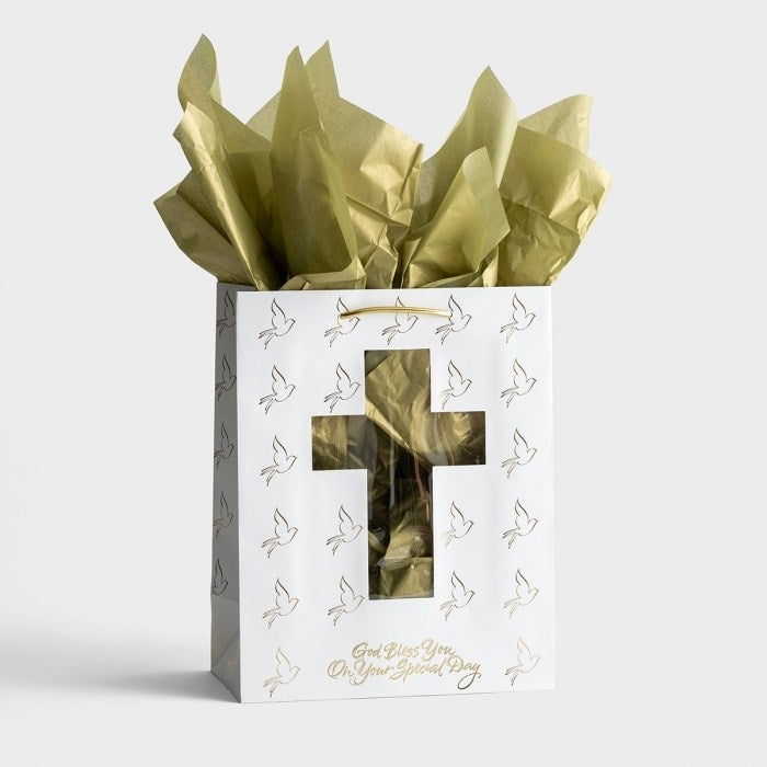 Gift bag with gold tissue paper on a white background