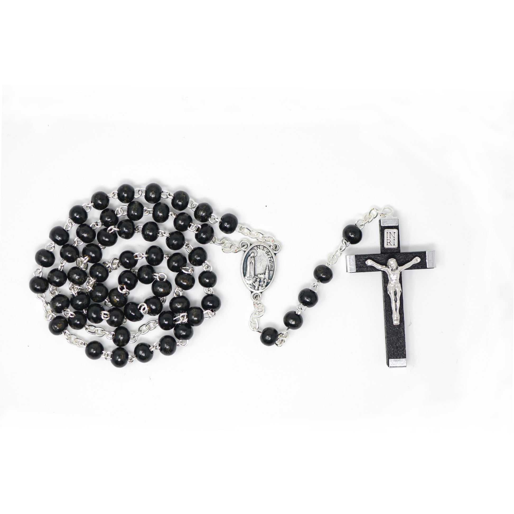 Black wood rosary with Our Lady of Fatima centre and a silver crucifix, displayed on a white background.