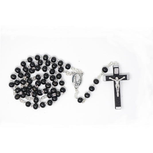 Black wood rosary with Our Lady of Fatima centre and a silver crucifix, displayed on a white background.