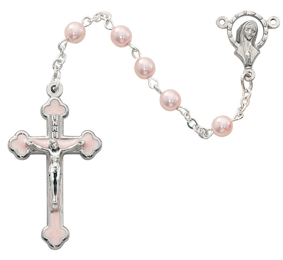A pink rosary with silver ox crucifix and pearl beads, featuring pink enamel accents.