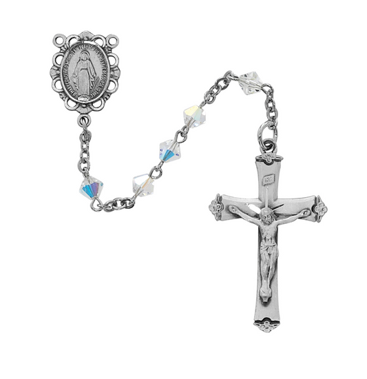 Silver rosary with crucifix on a white background