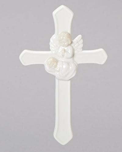 White ceramic cross with angelic figure on a gray background