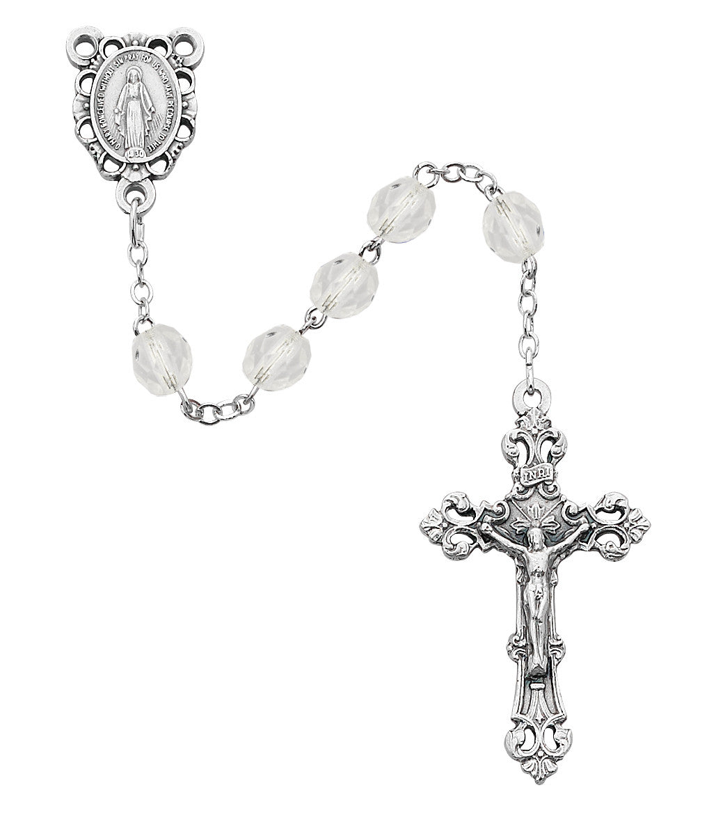 Silver rosary with clear beads on a white background