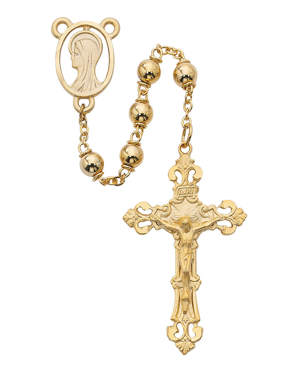 Gold rosary with a cross and medal on a white background
