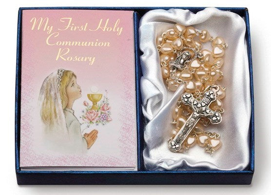 A Communion Rosary with heart-shaped glass pearl beads and a silver tone crucifix and chalice centerpiece, presented in a box with a First Communion themed card.