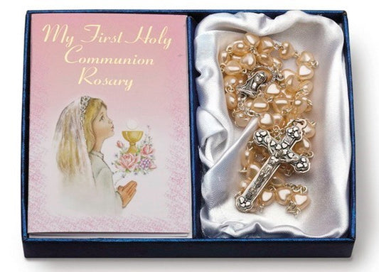A Communion Rosary with heart-shaped glass pearl beads and a silver tone crucifix and chalice centerpiece, presented in a box with a First Communion themed card.