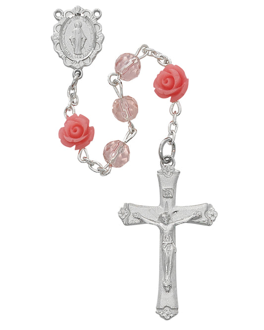 Silver rosary with pink roses on a white background