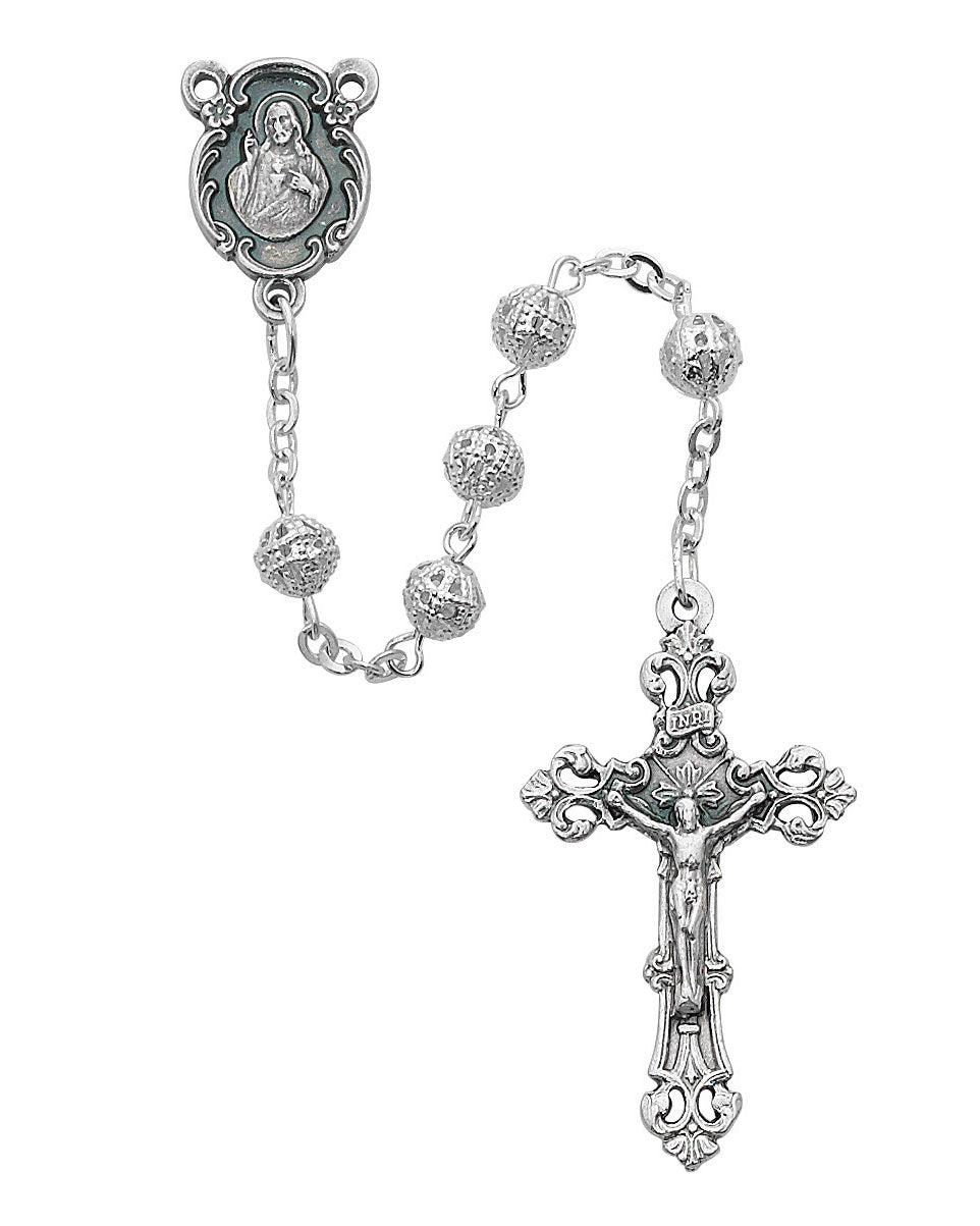 Silver rosary with cross and medal on a white background