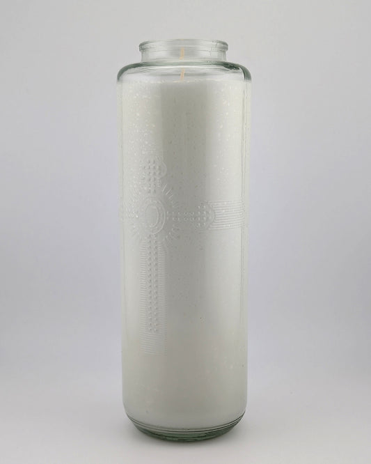 Tall glass candle with embossed design on a white background