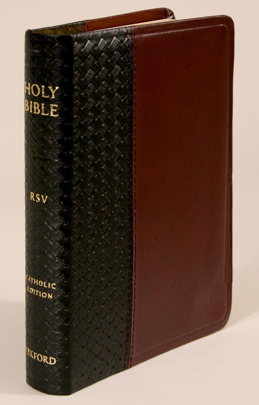 Black and brown Bible with 'Holy Bible RSV Catholic Edition' text on a beige background