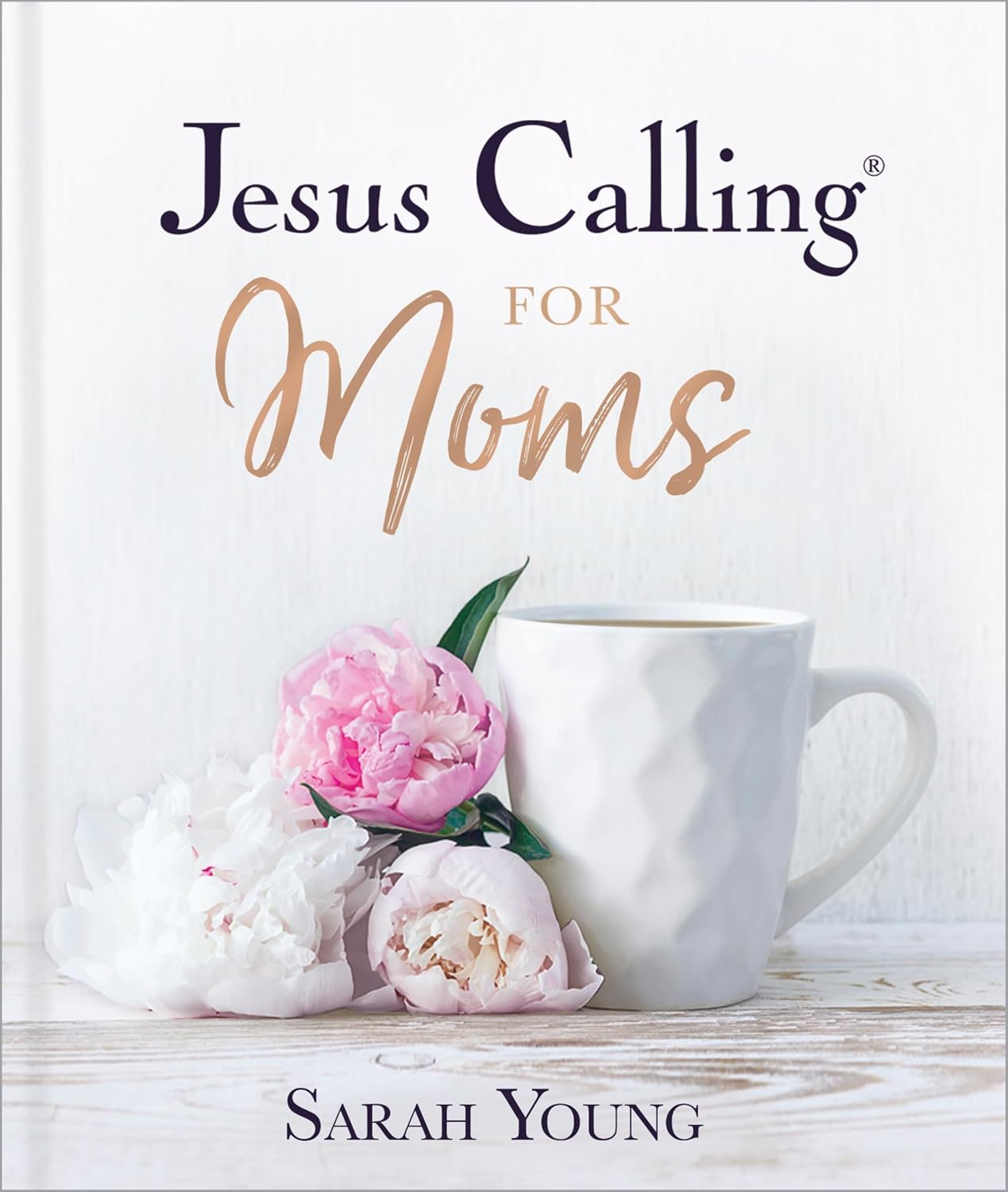 Book titled 'Jesus Calling for Moms' by Sarah Young with a cup and flowers on a white background