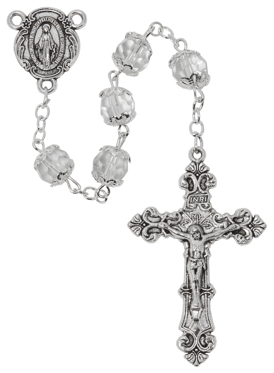 Silver rosary with clear beads on a white background