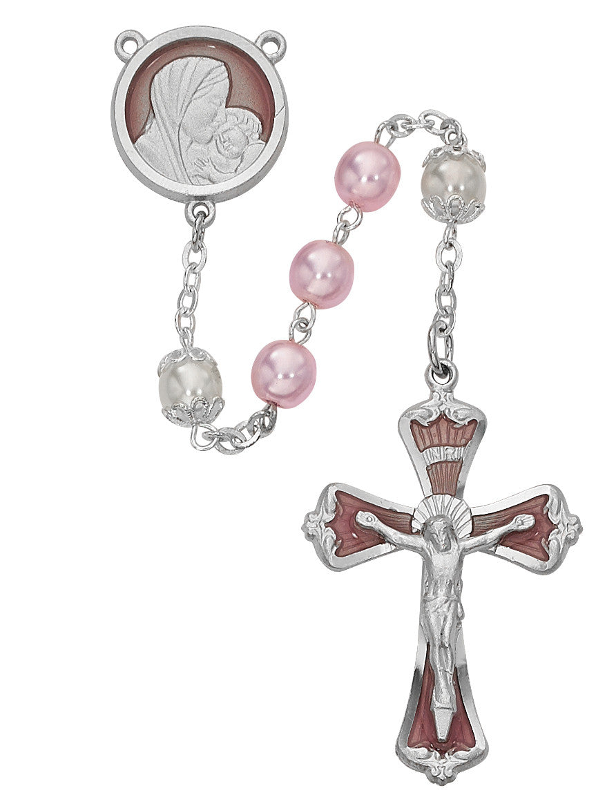 Rosary with pink beads and silver cross on a white background