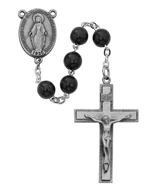 Black rosary with silver crucifix and medal on a white background