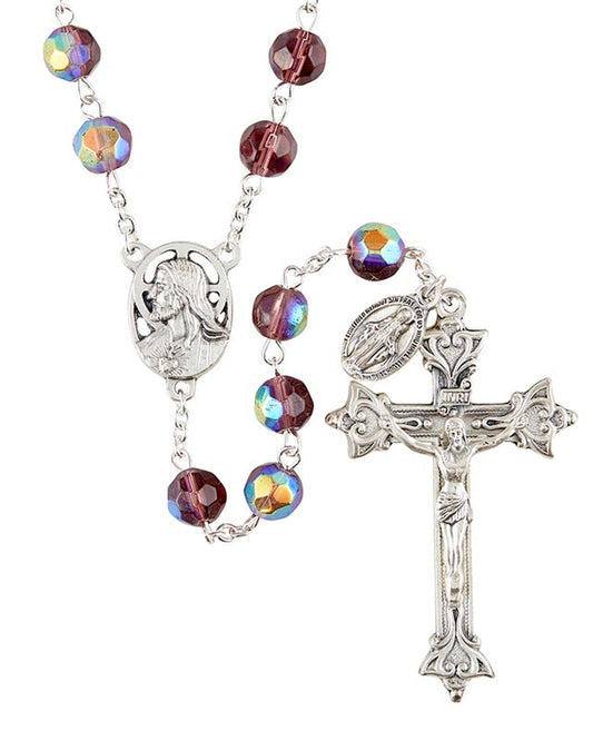 A silver-colored rosary with fire-polished beads and a crucifix, featuring a chain and bead design.