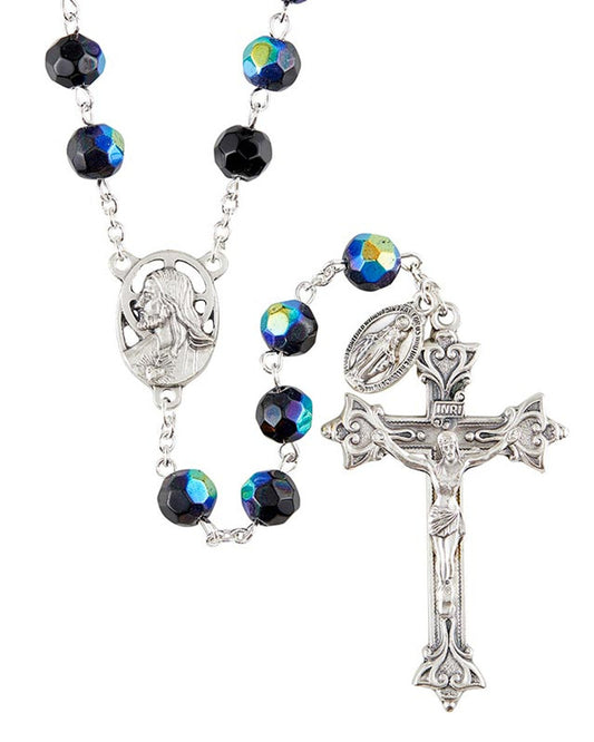 A silver-colored rosary with black fire-polished beads and a crucifix