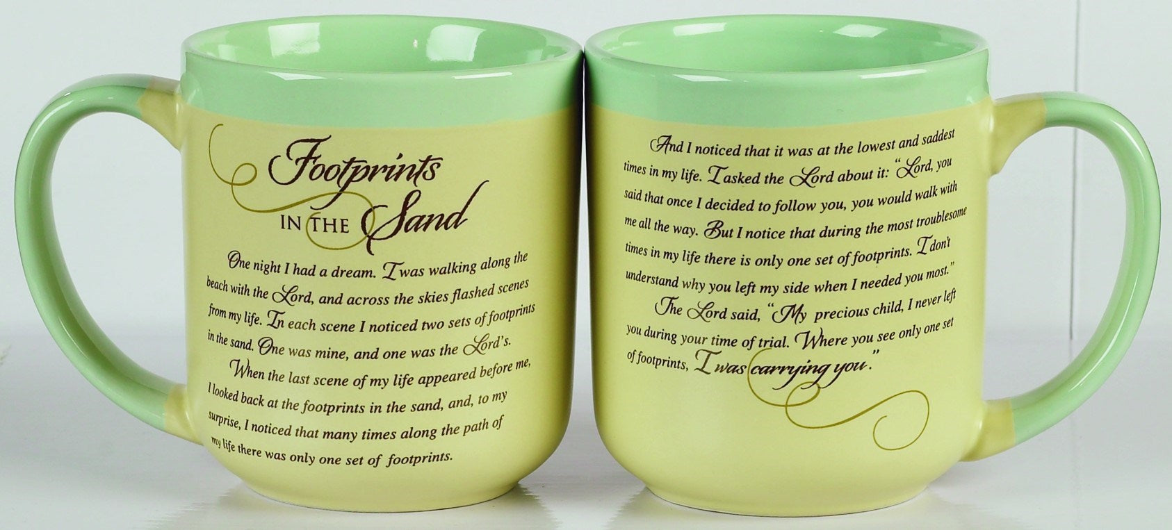 Two green mugs with 'Footprints in the Sand' text on a white background