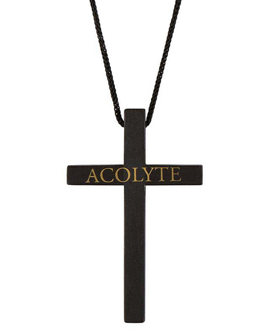 A black pine wood cross necklace with the word 'Acolyte' written on the cross pendant.
