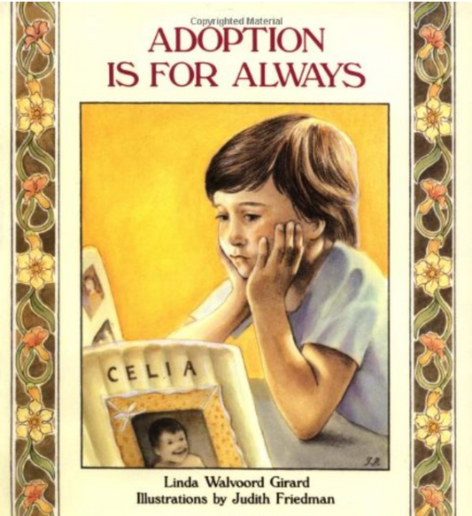Book cover of 'Adoption is for Always' with a child looking at a photo frame.