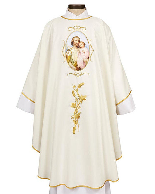 A white chasuble with gold accent embroidery and lace trim, featuring an image of Saint Joseph and Child.