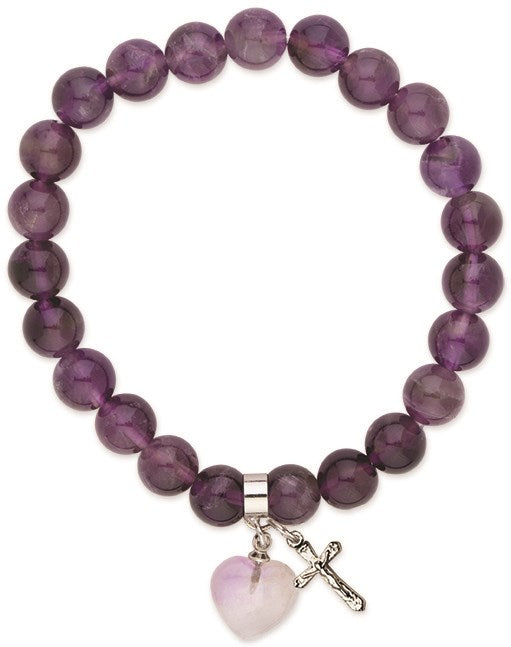 Purple beaded bracelet with a heart and cross charm on a white background