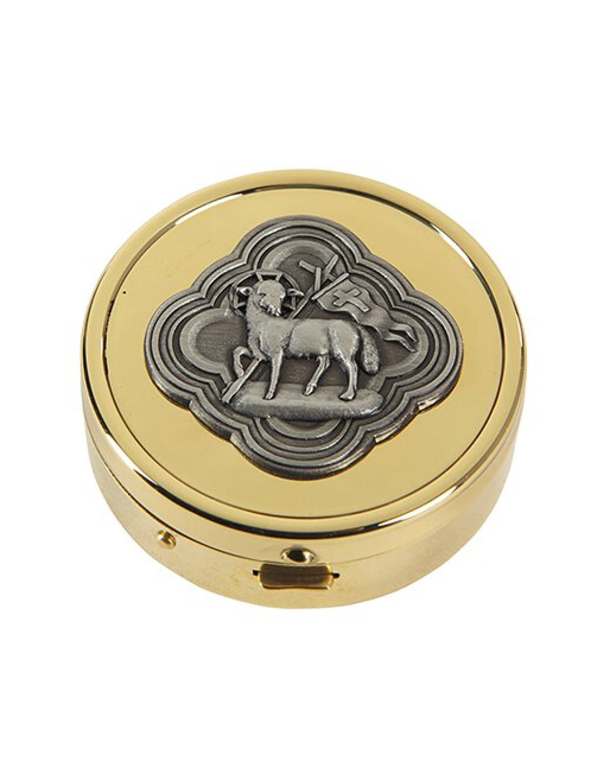 Round gold pill box with silver emblem on a white background