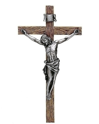 Statue of a crucified figure on a wooden cross with silver accents on a white background