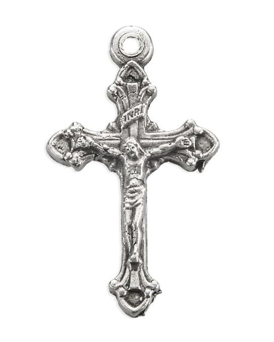 Silver cross pendant with Jesus Christ figure on a white background