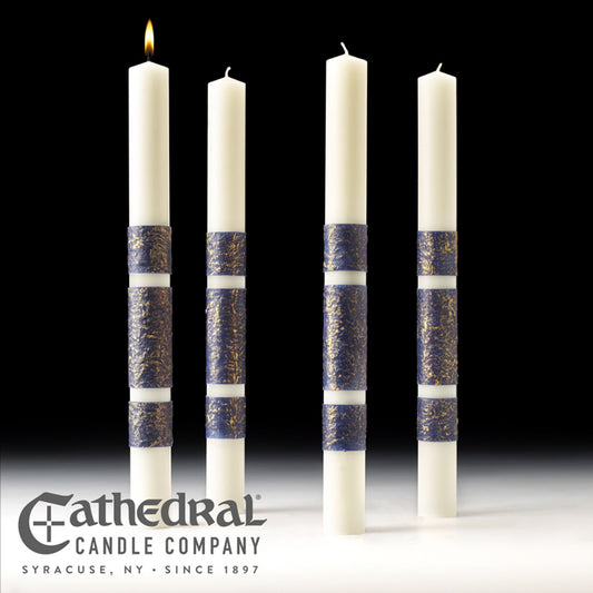 Four white candles with blue bands arranged in a row on a black background, featuring the Cathedral Candle Company logo.