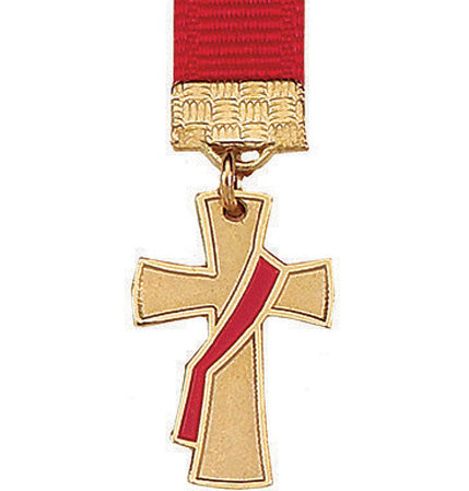 Gold cross medal with red ribbon on a white background