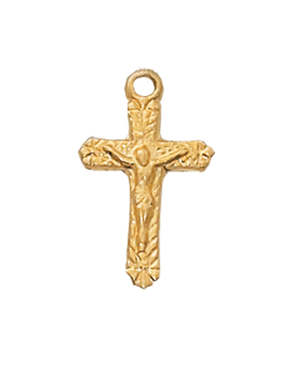 Gold cross pendant on a white background