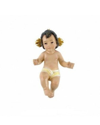 Small figurine of a baby with braided hair on a white background