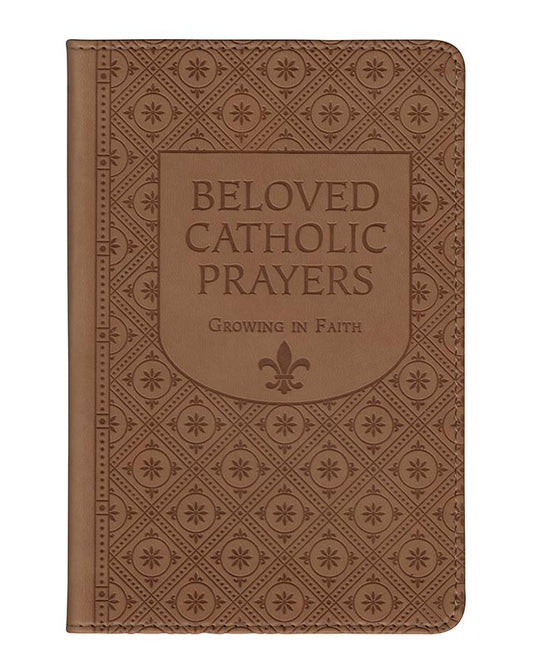 A brown leatherette cover of a book titled 'Beloved Catholic Prayers' with gold page edges and ribbon markers, featuring an embossed floral pattern and the text 'Growing in Faith'.