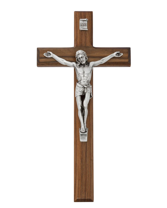 Wooden cross with silver Jesus figure on a white background