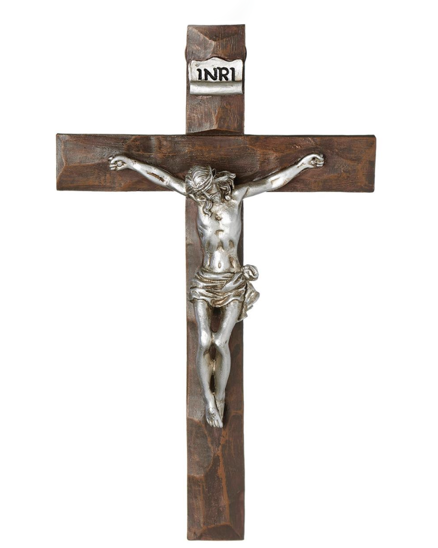 Wooden cross with silver Jesus figure on a white background