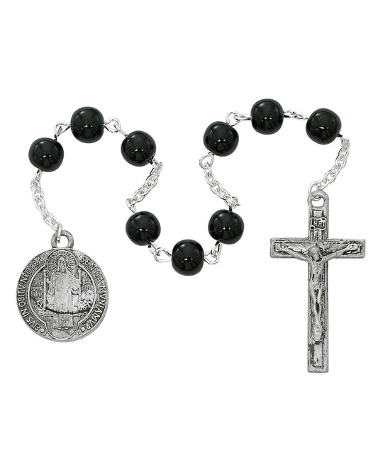 Black rosary with silver crucifix and medal on a white background