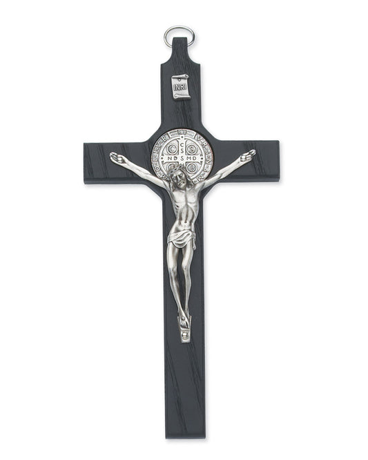 Black crucifix with silver Jesus figure on a white background