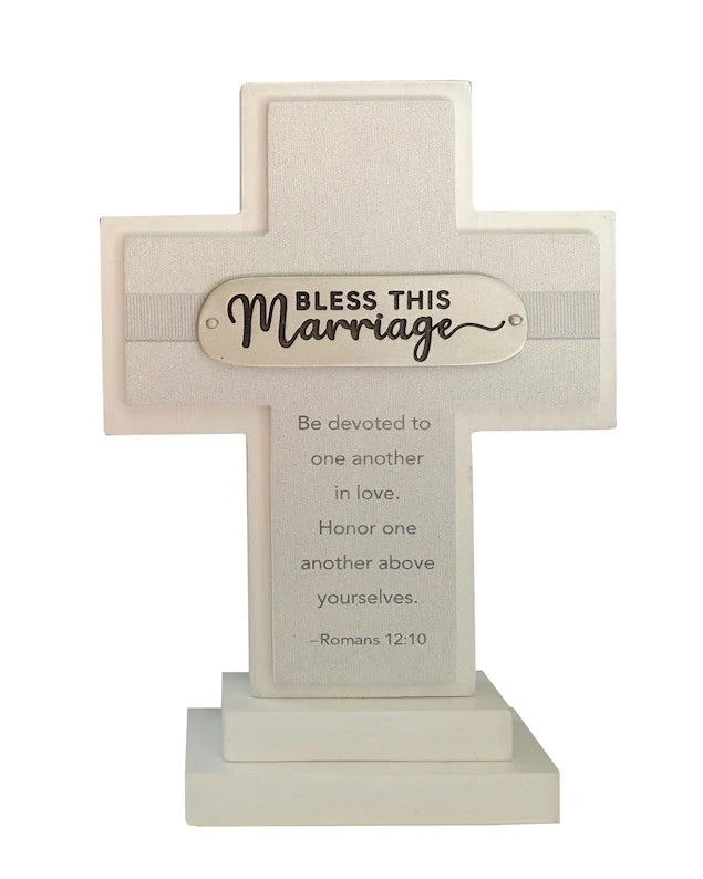 Decorative cross with 'Bless this Marriage' inscription on a white background