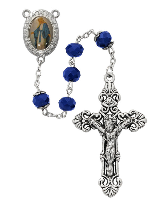 Rosary with blue beads and silver crucifix on a white background